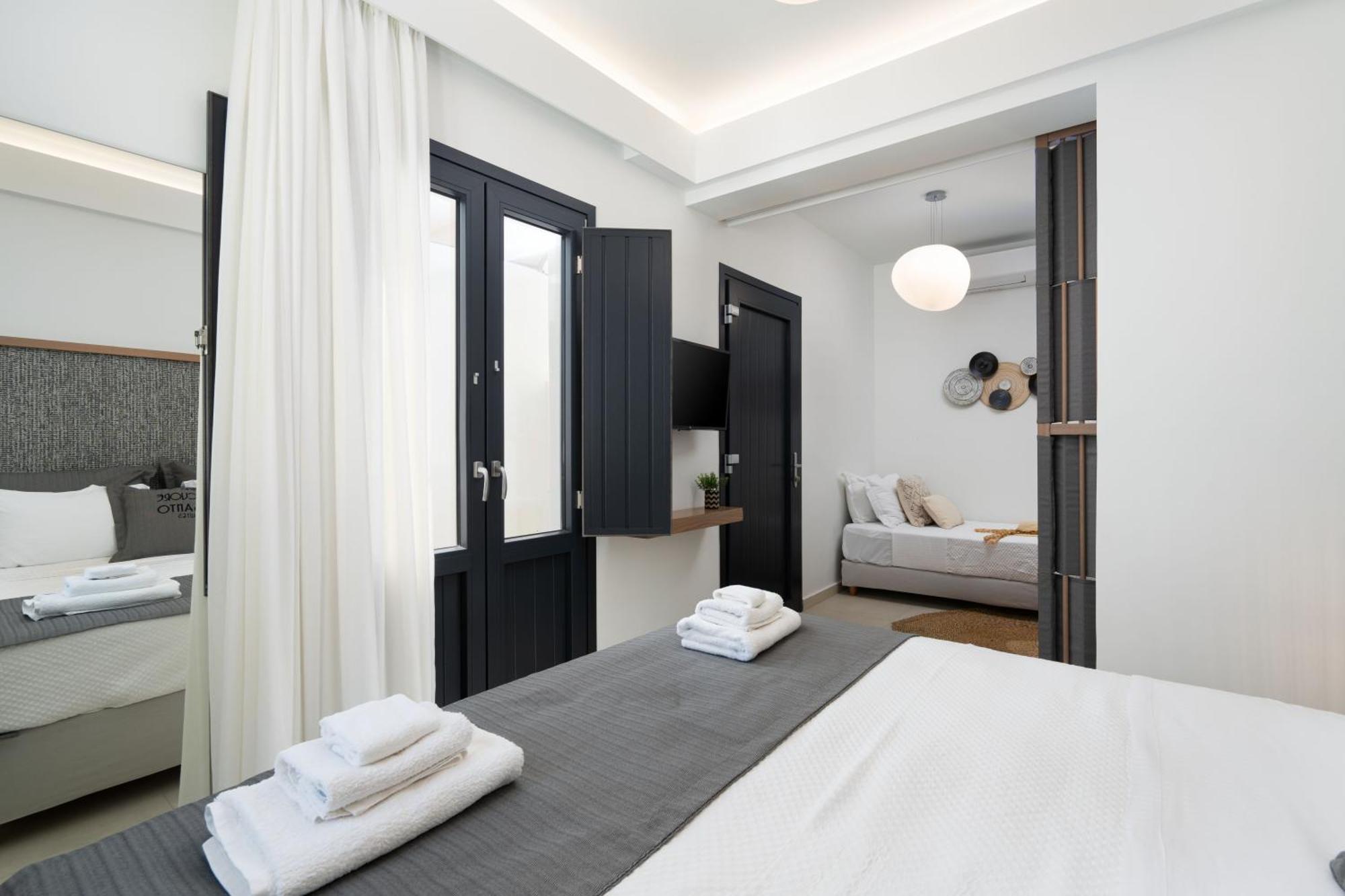 Cuore Santo Suites Тира Номер фото