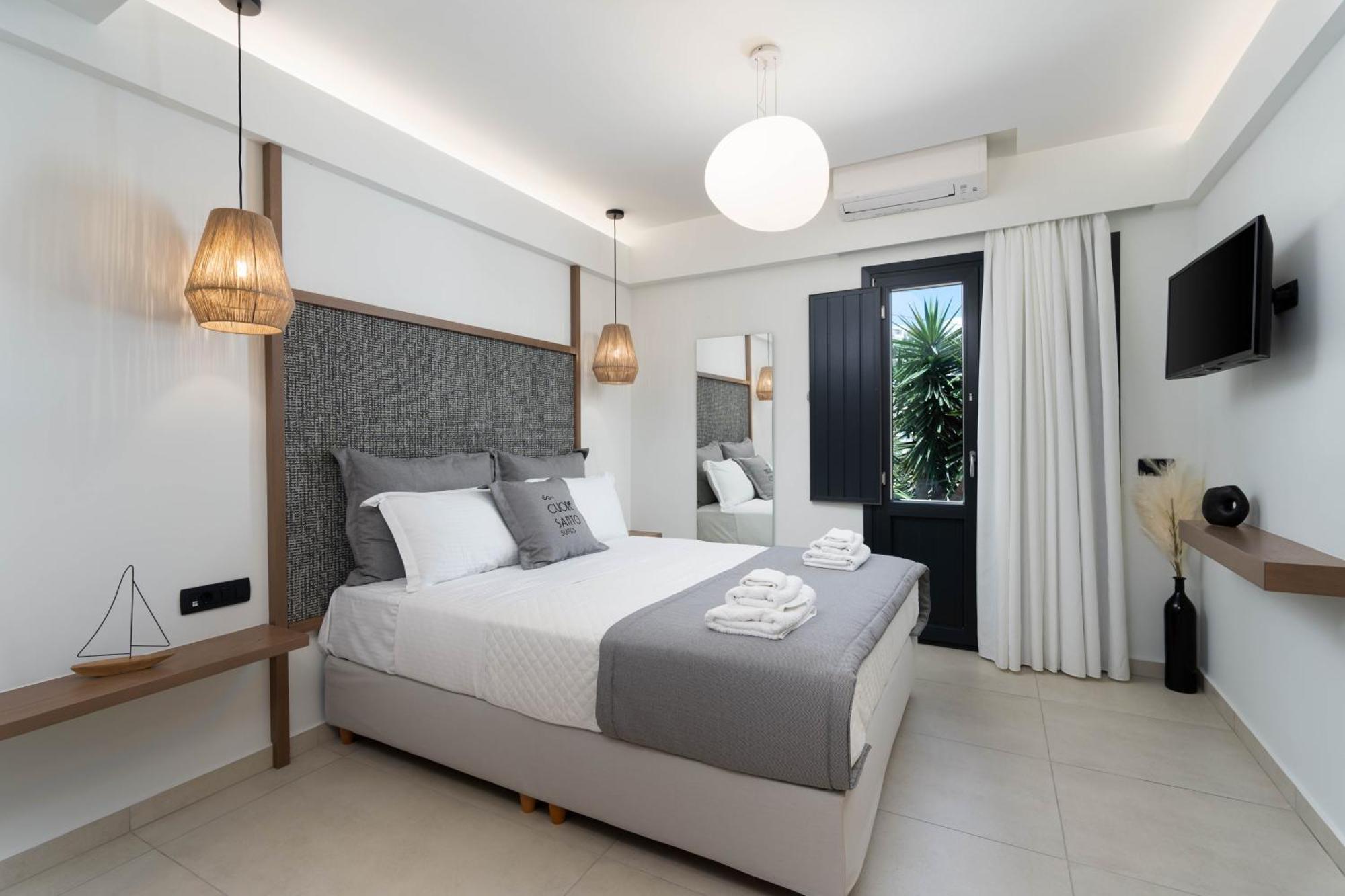 Cuore Santo Suites Тира Номер фото
